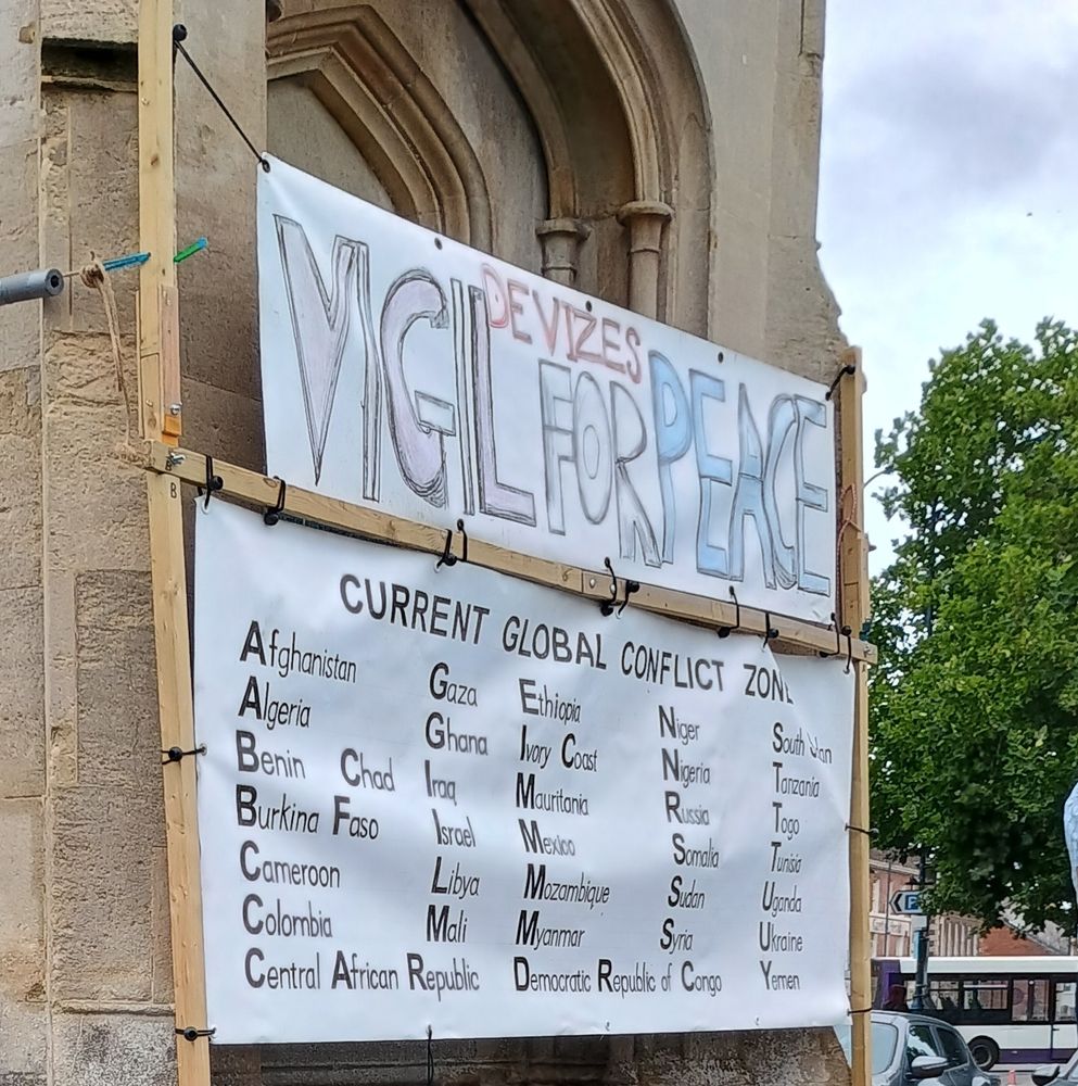 A sign saying devizes vigil for peace with a list of global conflict zones, notably including Israel but not Palestine 