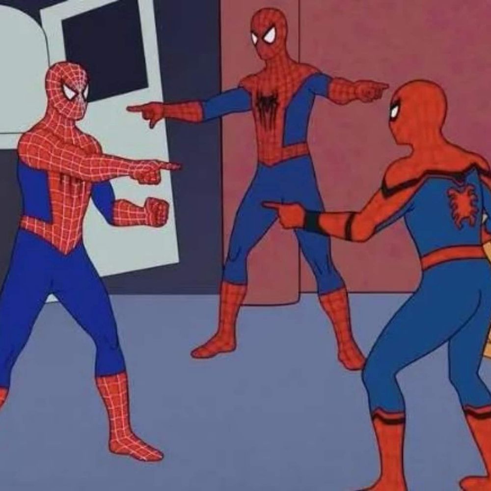 Three Spider-Man’s point at each other in a triangle.