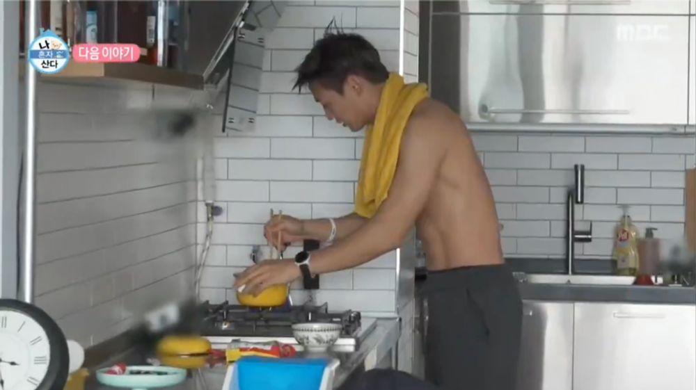 Shirtless Minho doing some kind of competitive ramen cooking while shirtless in his kitchen
