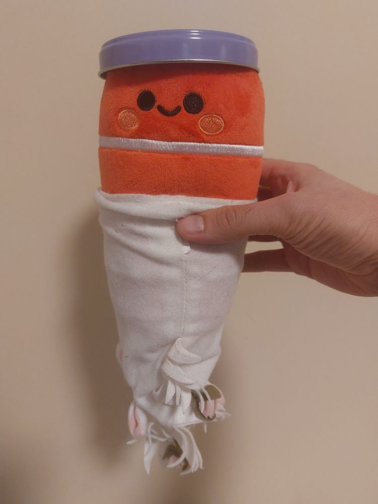 A plush oracle database wearing a flat dumbledore hat and a unicorn hand puppet as a beard