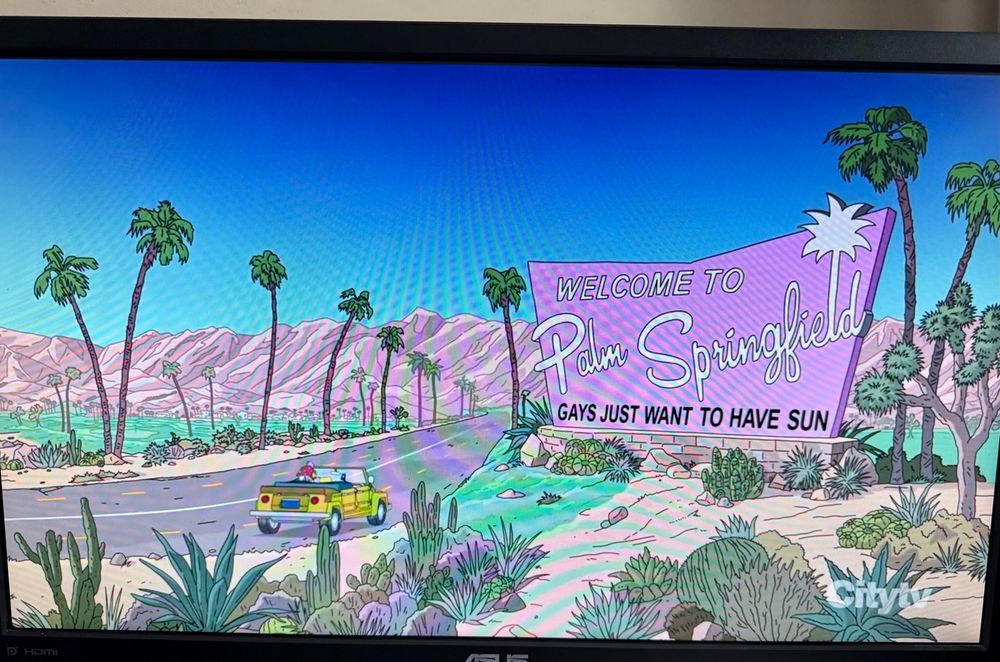 Screen shot of The Simpsons with Welcome to Palm Springfield sign. 