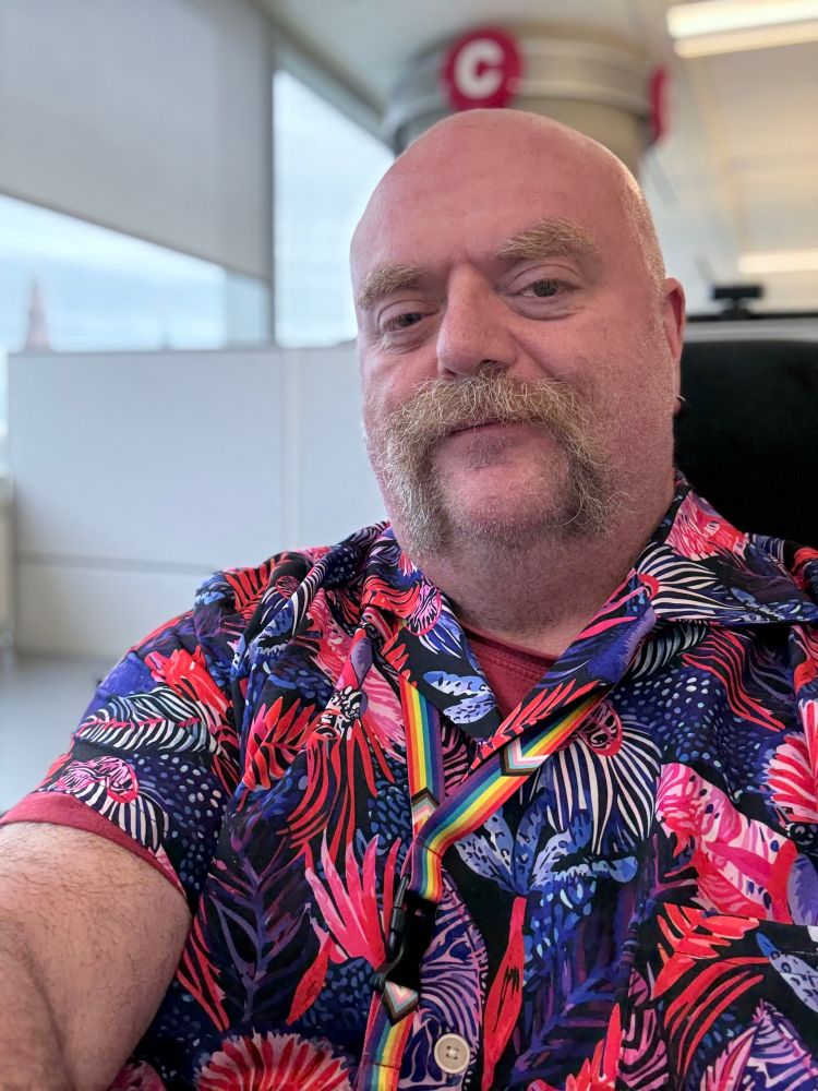 Man in floral shirt   