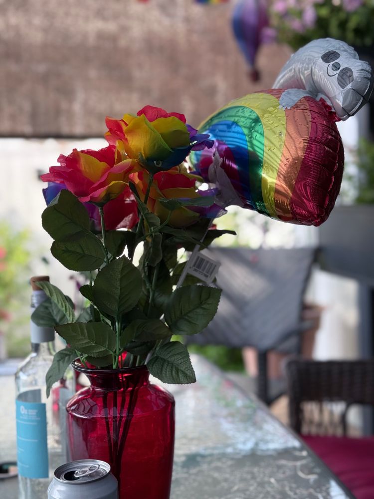 Rainbow silk flowers w balloon. 