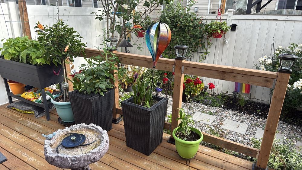 Same deck and railing but with plants