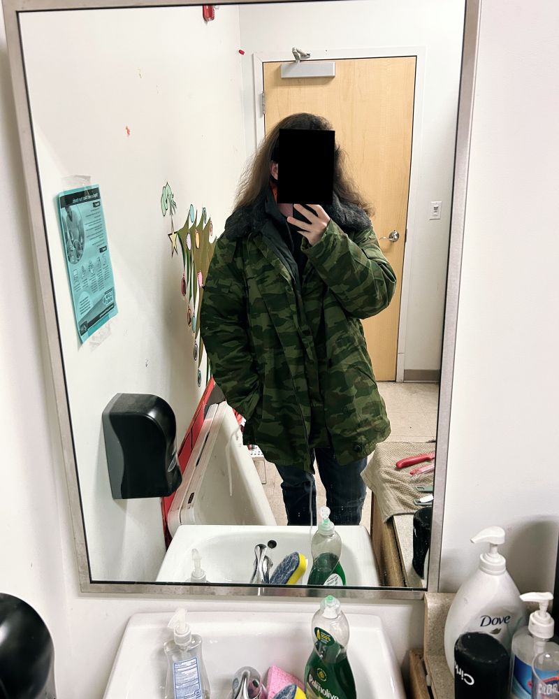 A picture of me wearing a VSR-98 parka, taken at work.