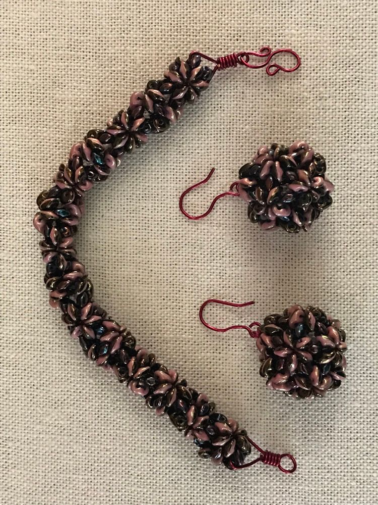 Beaded earrings and bracelet, black and pink