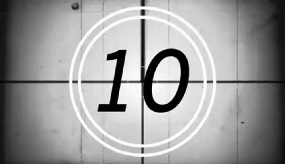 a black and white photo of a countdown timer with the number 10 in the center .