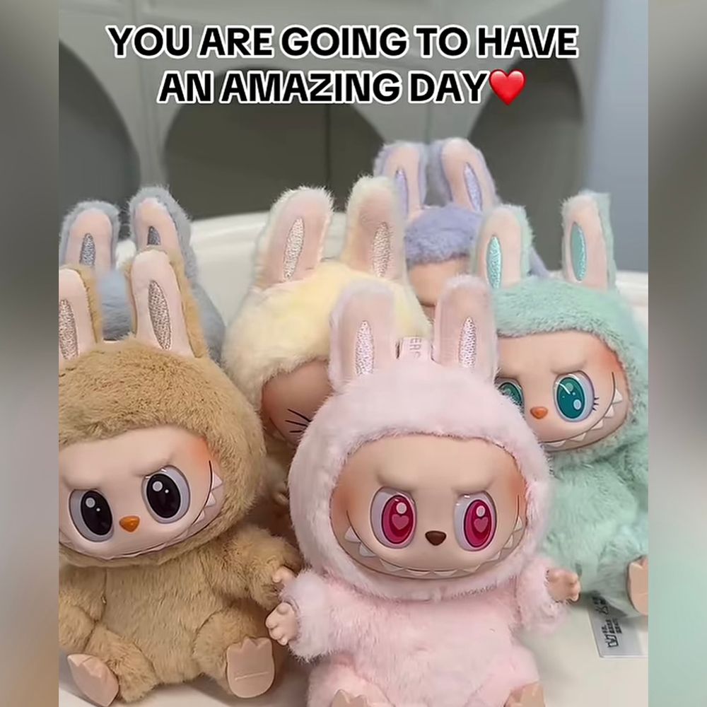 Close up photo of have a set Labubus with the text you are going to have an amazing day