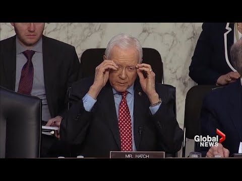 U.S. senator removes glasses that aren't there