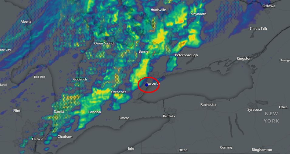The image is a weather radar map showing precipitation over parts of Ontario, Canada, and New York, USA. The map displays various cities, including Toronto, Kitchener, London, Ottawa, Buffalo, and Syracuse. A red circle highlights the area around Toronto, where a significant amount of precipitation (indicated by yellow and green colors) is shown.