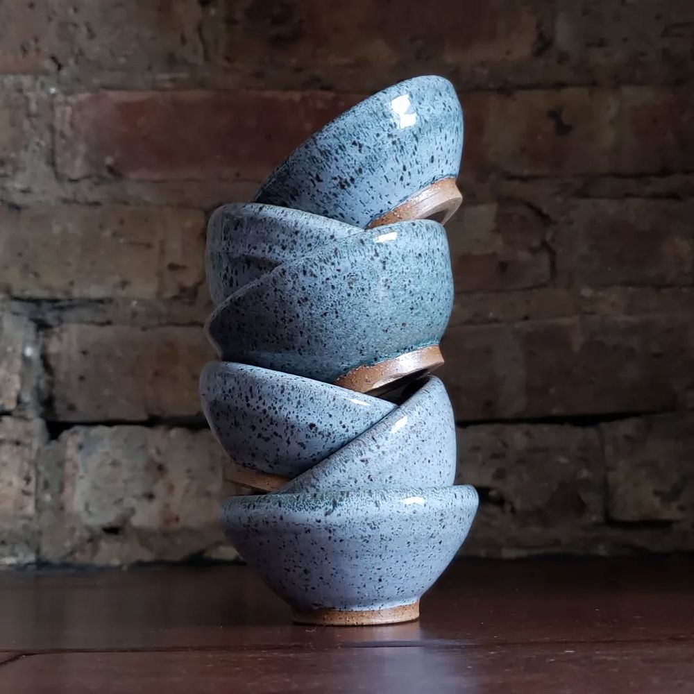 6 small spice bowls stacked