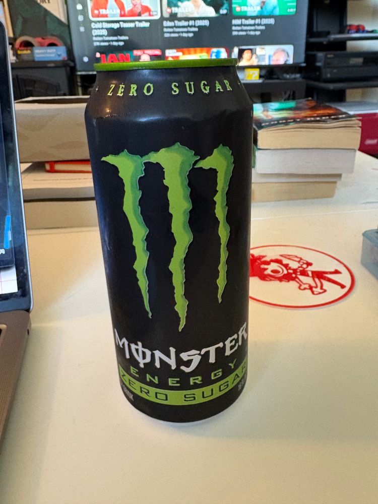 A black and green 16-oz. can of original flavor Zero Sugar Monster Energy.