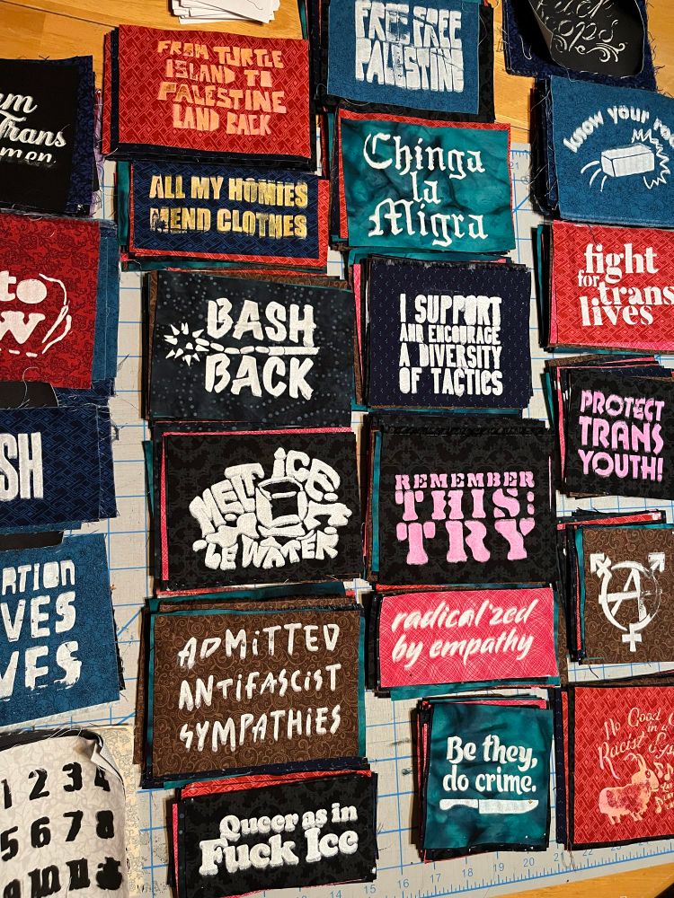 A bunch of stacks of patches on a table 