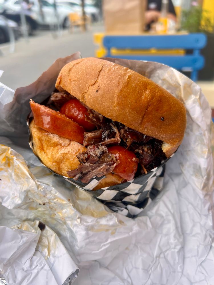 texas style brisket and hot links on a brioche bun 