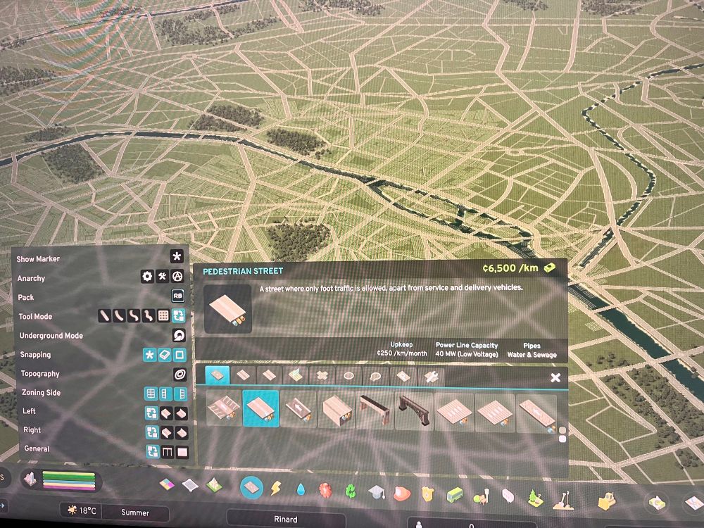 a screen shot of cities skylines 2. there’s an empty map of paris in the background. there a pop menu that says “pedestrian street” and i’m about to replace all of these roads with that 