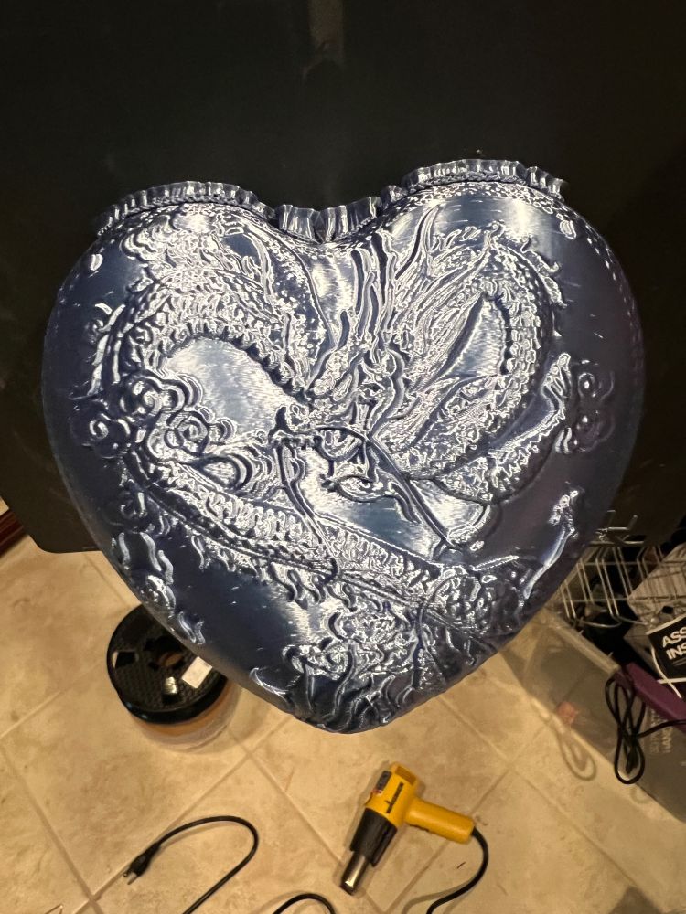 Completed heart shaped lid with dragon design