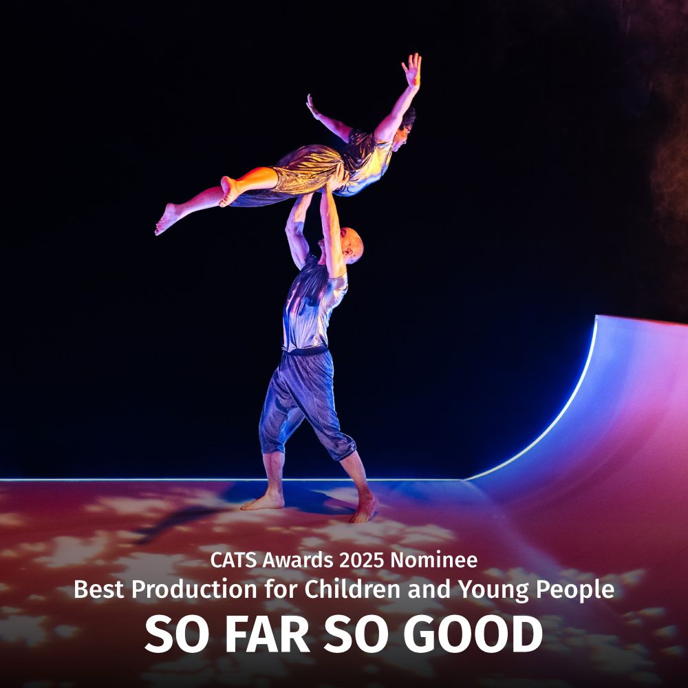 Image of two performers in an acrobatic pose on a stage with red and blue lights, with white text of the name of the show underneath.