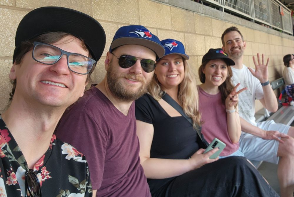 Doug, Jamie, Maria, Katie, and Snarfy posing at the Twins vs. Cubs game in Minneapolis. They're smiling because the Cubs haven't lost yet.