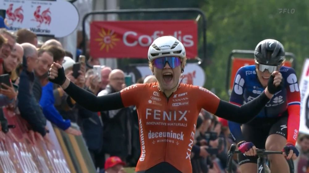 Puck Pieterse raised hands, crossing finish line at La Flèche Wallonne Feminine 