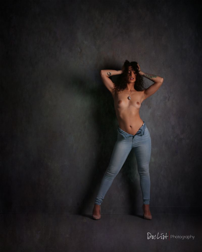 Austin, Texas model Victoria M'Lynn posing topless, wearing tight blue jeans