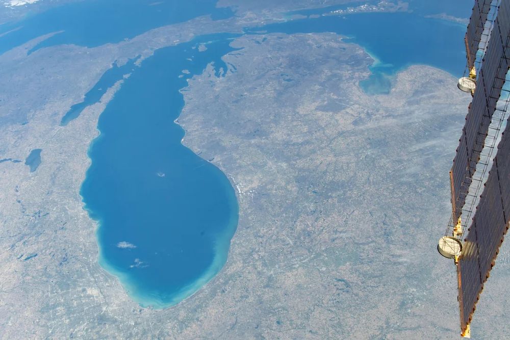 Photo of Lake Michigan, Michigan, and part of Lake Huron from the International Space Station. Part of the ISS' solar array is visible on the right edge of the shot. Photo by astronaut Jeanette Epps. 