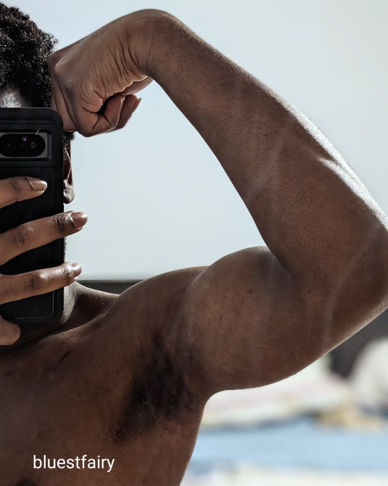 Fairy flexing his arm while posing in the mirror