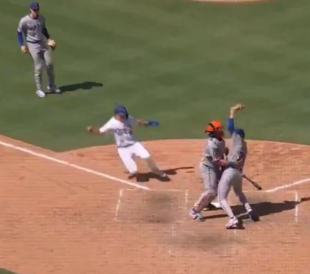 two mets bonking into each other near home plate as a dodger scores a run 

remember: trans rights are human rights 