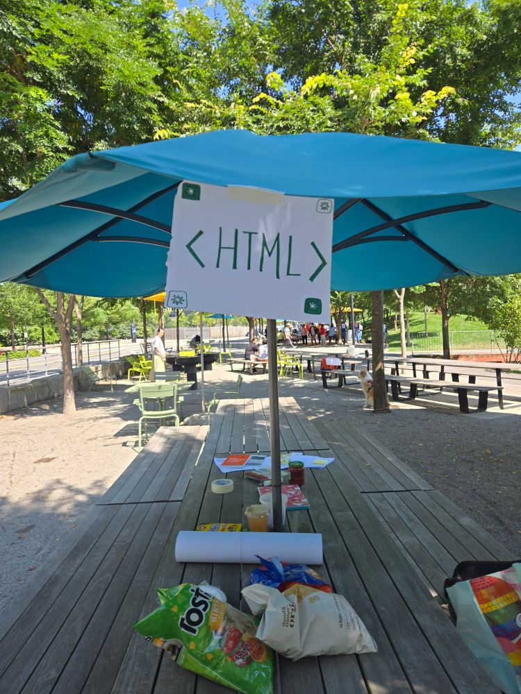 picnic table with an HTML sign