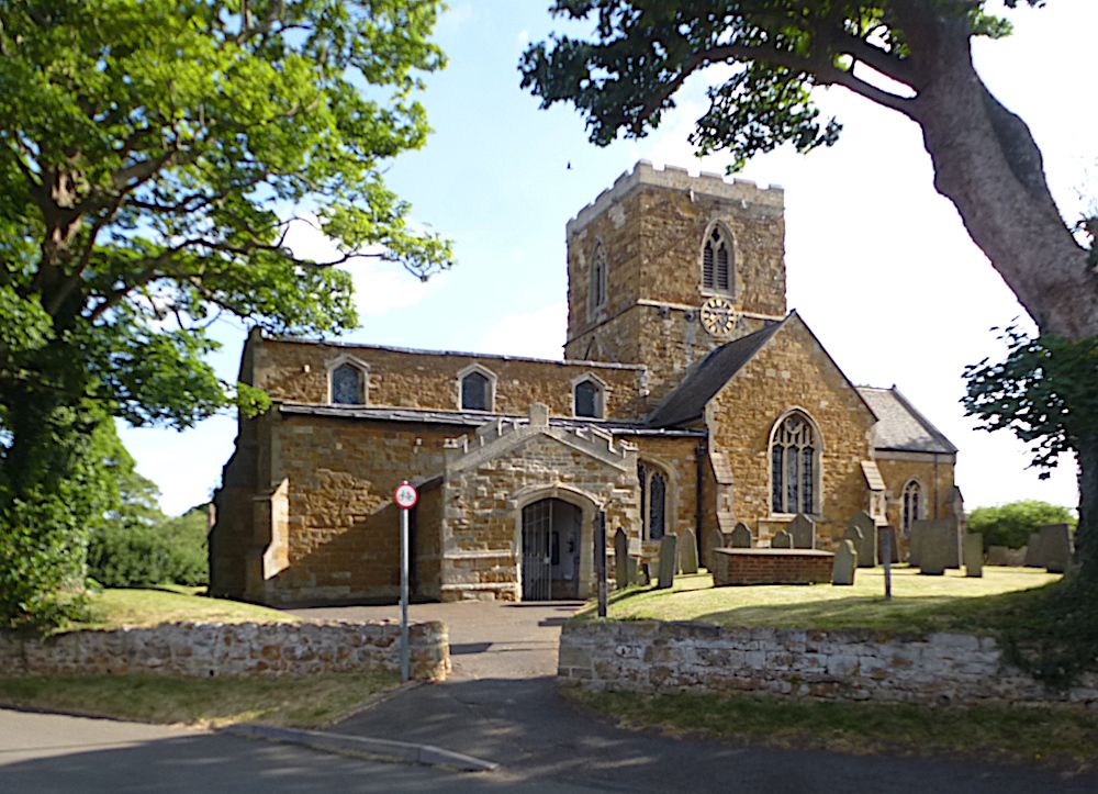 A pretty country church with porch and transept and central, crenellated tower