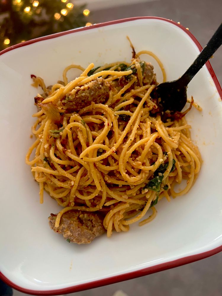 Creator showcases picture of caramelized onion 🧅 Italian sausage pasta 🍝 that was made today 