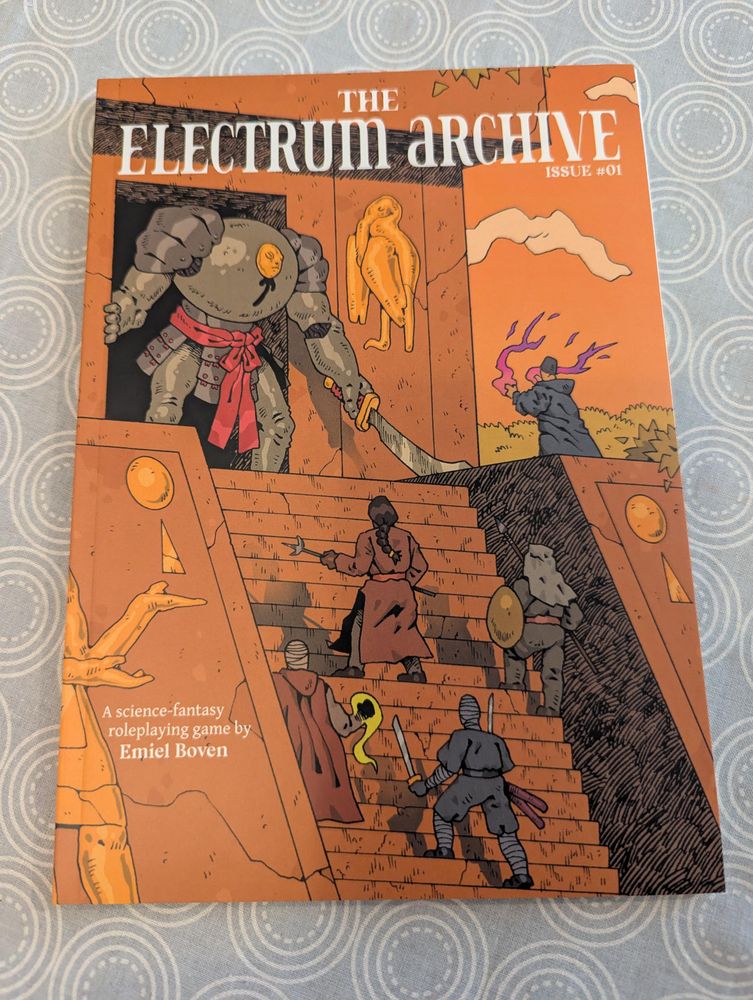 Front cover depicts adventurers advancing weapons drawn up the steep steps of a vaguely Egyptian temple. At the top, emerging from the great black doorway, a huge golem(?) of samurai armour with a tiny mask for a face. Sky and pyramid form a strikingly orange background.