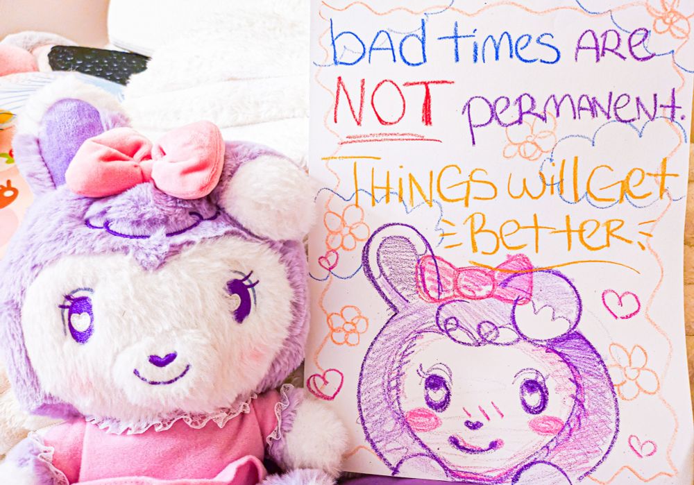 A stylized crayon on paper illustration of a bipedal mostly light purple bunny character with text above her reading: bad times are NOT permanent. things will get better.