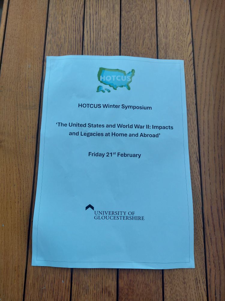 Sign for a symposium titled "The US and World War 2: impacts and legacies at home and abroad"