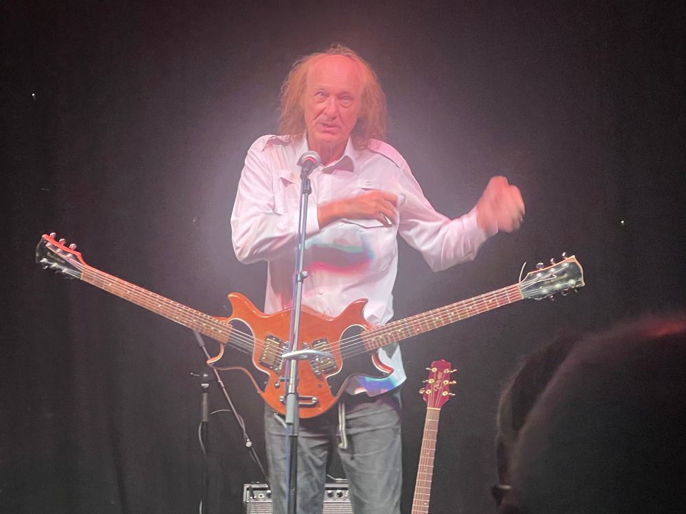 Showing 2 mirror image guitar bodies and necks