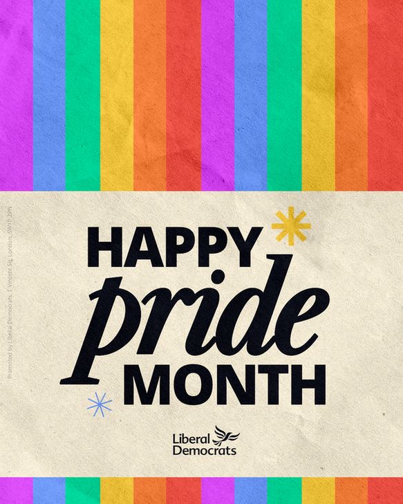 Rainbow flag overlaid with a banner which says "Happy Pride Month"