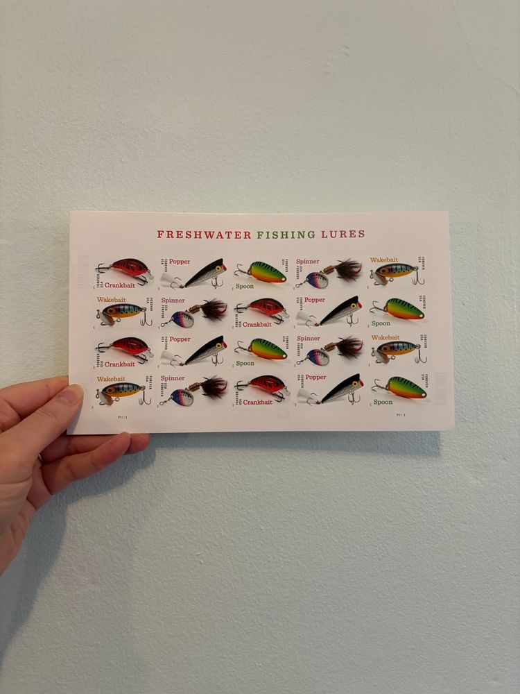 Sheet of 20 postage stamps with the title “Freshwater Fishing Lures”. 5 stamps with different close ups of lures