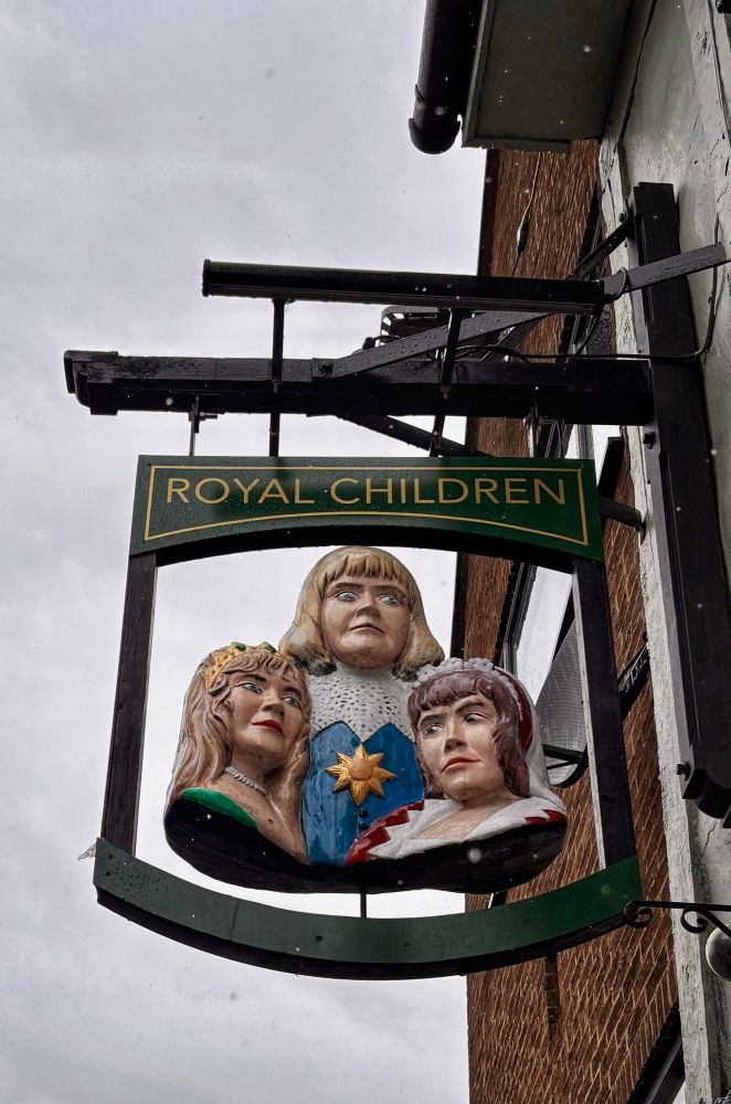 The pub sign for the ‘Royal Children’ pub in Nottingham. It features three torsos, two female and one male, looking v shocked. The overall effect is v odd