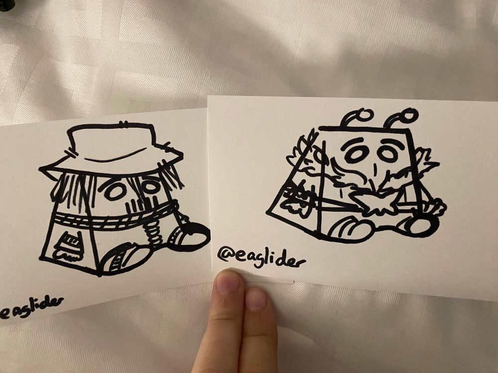 A photo of doodles of Scarecrow and Killer Moth from DC comics in the shape of blocks of cheese.