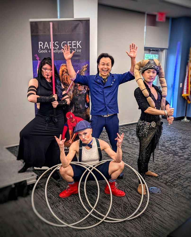 Performers in cosplay in a library program room. 