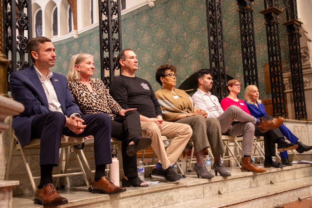 DNC Chair Ken Martin seated on stage with other Democratic officials who participated in a town hall event in Bethlehem, PA.