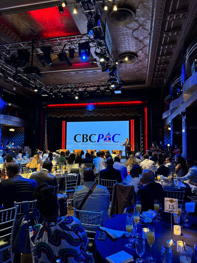 Crowd attending the CBCPAC 2025 New York Retreat, listening to DNC Chair Ken Martin speak. 