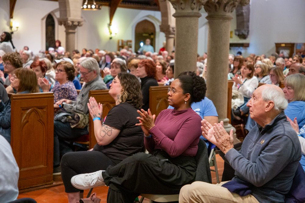 Attendees at the town hall clapping