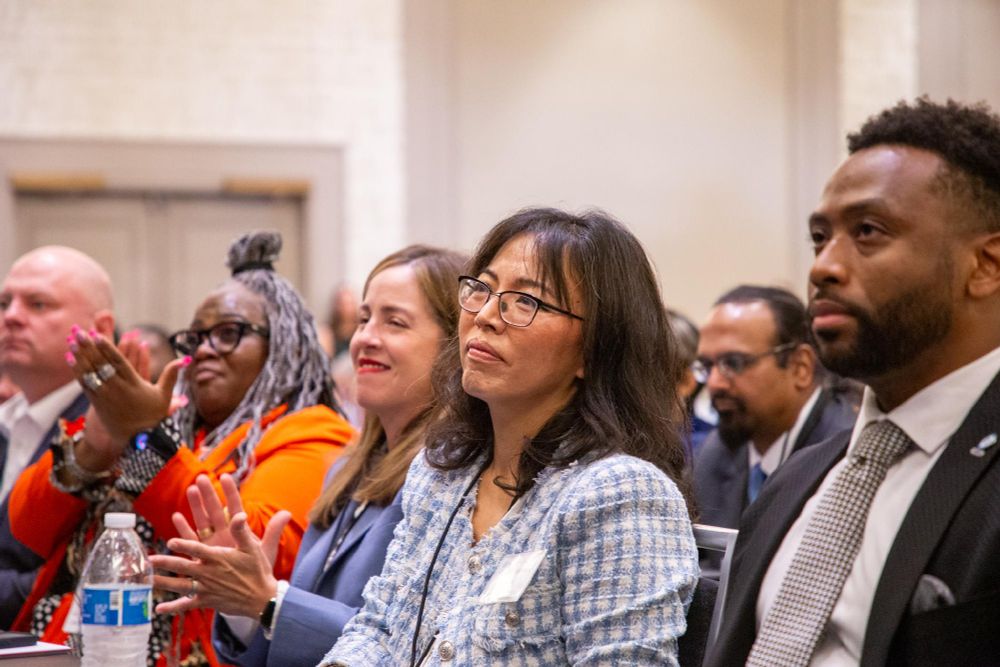 DNC delegates listening intently during the DNC Summer meeting.