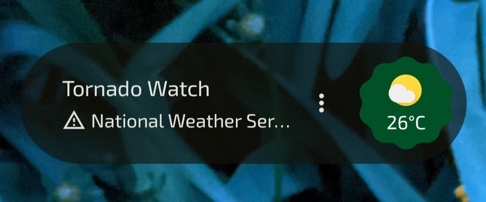 partial screenshot: Tornado Watch and Temperature 26°C on a widget.