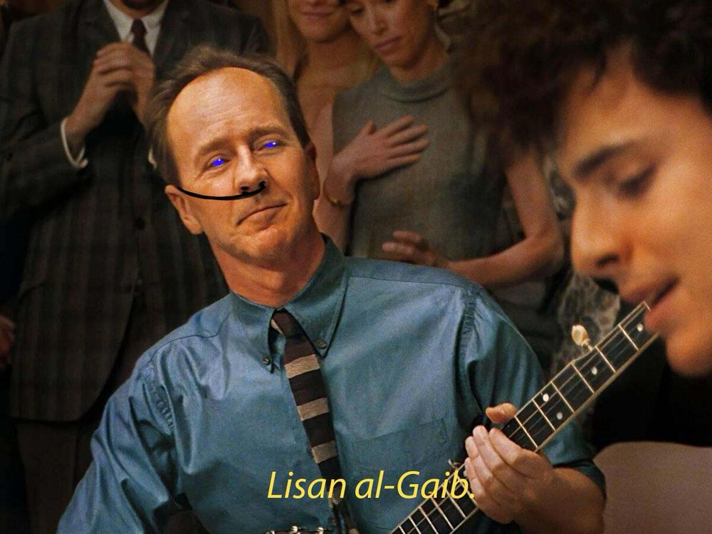 Pete Seeger (Edward Norton) looking admiringly at bob Dylan (Timothée chalamet) in a still from A Complete Unknown, but the dune nose thing is crudely drawn on him and the subtitle says “Lisan al-Gaib”