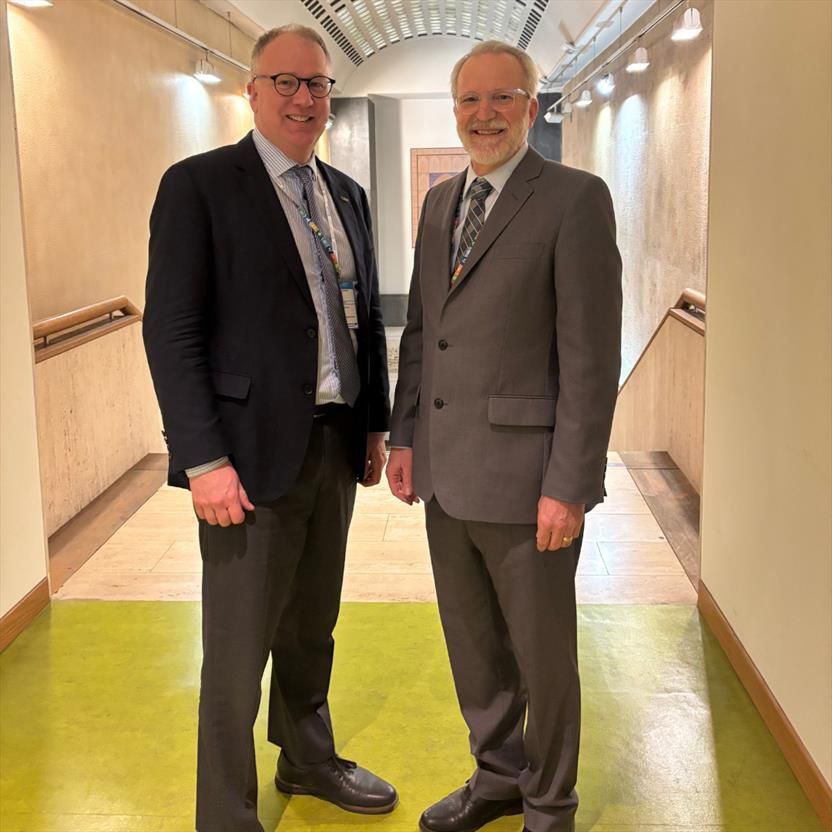 photograph of joe and Benoit standing in a hallway together 