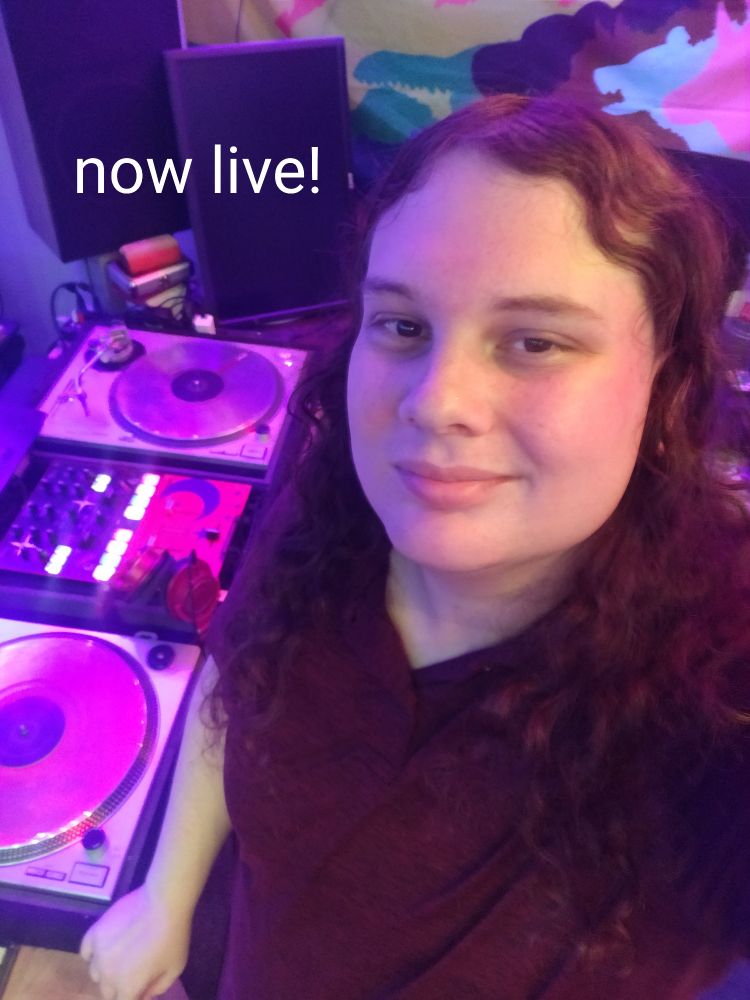 Sierra standing in the dj studio with a caption saying "now live!"