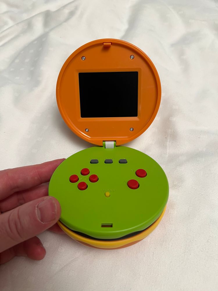 It’s a cheeseburger-shaped game console. Not a switch prototype. Cheeseburger.