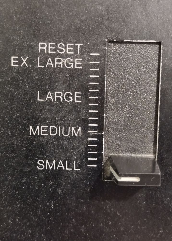 a switch with the options, SMALL MEDIUM LARGE EX. LARGE and RESET

The switch is set to SMALL