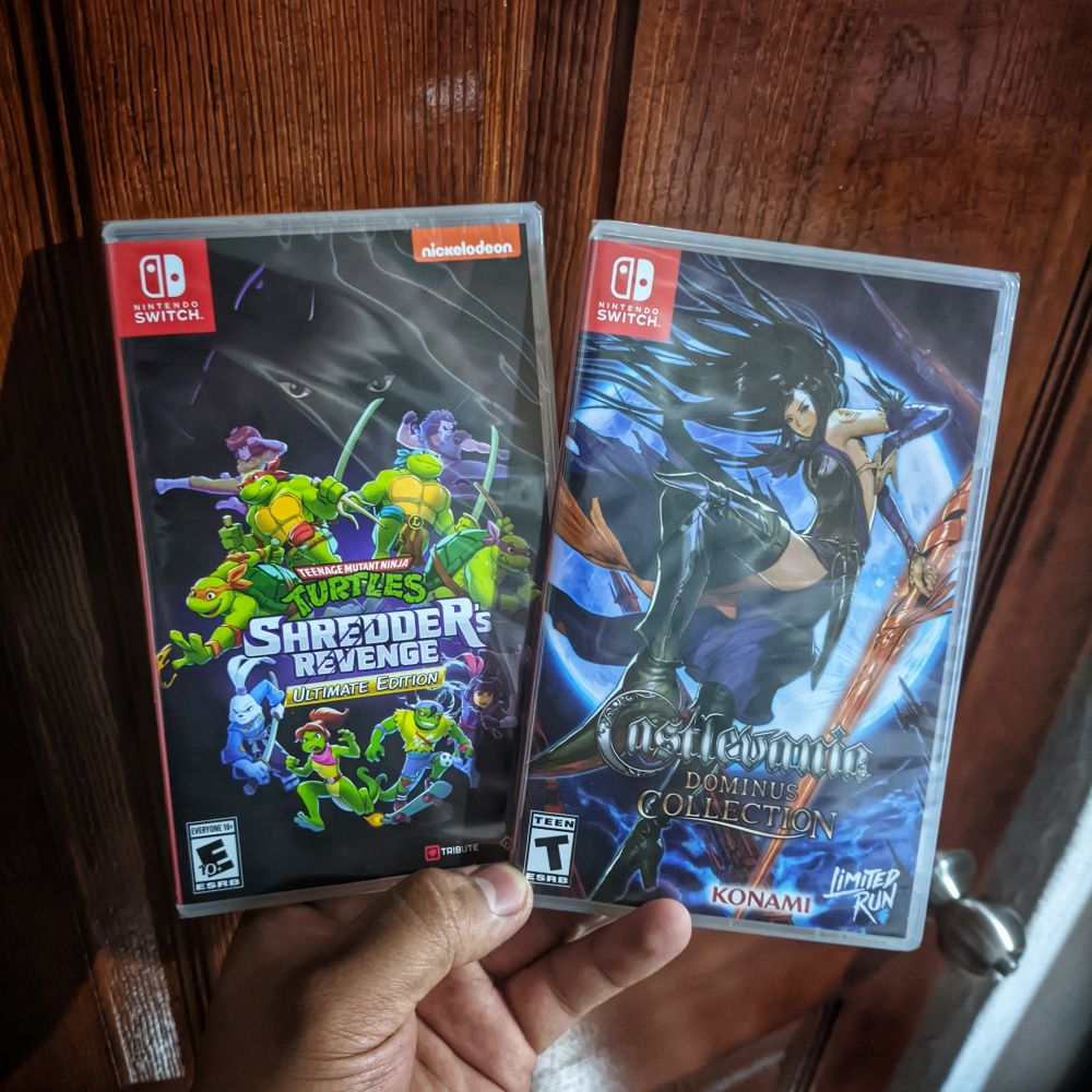 Two physical cases of the games, still sealed